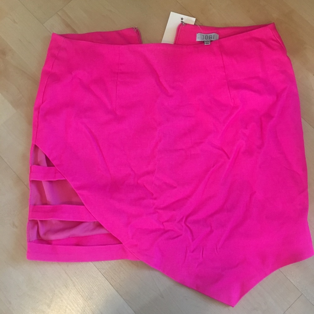 Bright pink mini skirt with cut outs